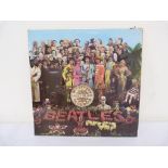 Beatles Sgt Pepper 1st MONO UK pressing with flame inner and cut-outs Condition Report.