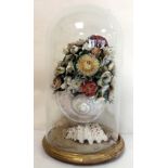 Victorian shell work display in the form of a large polished shell filled with flowers,
