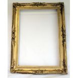 Large 19th century gilt gesso rectangular picture frame with pierced foliate moulding,