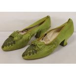 Pair of late 19th century pea green silk lady's evening shoes,