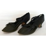 Pair of late 19th century Monquignon, Paris, black silk lady's evening shoes with wine glass heel,