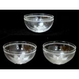 Three clear glass circular finger bowls with blaze cut base,