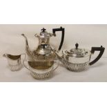 Three piece e.p.n.s. tea set of oval form with half reeded body & a similar coffee pot. (4).