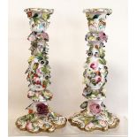 Pair of Meissen porcelain candlesticks with encrusted & painted floral decoration in polychrome &