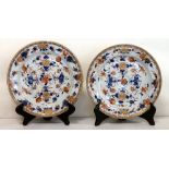 Pair of 18th century Chinese Imari plates with floral decoration, double ring & leaf mark to base,