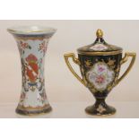 Small 19th century Continental armorial porcelain spill vase of concave hexagonal form with crest &