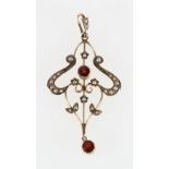 9ct gold open work pendant set with seed pearls and faceted garnet stones, 5cm long, 2.