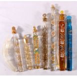 Seven Egyptian Art Glass scent bottles with gilt and painted decoration, the largest 22cm long,