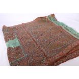 Mid 19th Century slender Kashmir shawl with turquoise centre and patched borders and end panels,