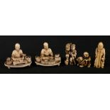 Two carved ivory Okimono of calligrapher and three small figures including a man riding a bear,