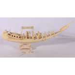 Early 20th century Indian ivory carving of a boat of elaborate design and bird figurehead,