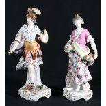 Pair of Derby style porcelain figures modelled as a warrior and a female with cornucopia and orb,