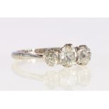 18ct white gold and platinum diamond three stone ring, the central diamond approximately 0.