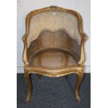 French gilt decorated bergere back and seat armchair,