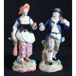 Pair of Derby style porcelain figures modelled as a male and female against a tree stump,