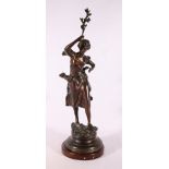 After Rousseau Bronze figure of a young lady in a flowing dress with arm aloft holding a branch,