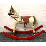 Early 20th century rocking horse on bow rocker, 97cm long.