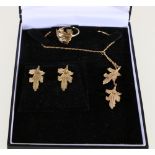 9ct gold suite of leaf jewellery including pendant, ring and pair of earrings, 7.