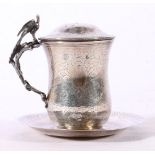 Arabic white metal mug and cover on saucer with allover incised decoration of crescent moon and