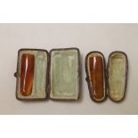 Two late 19th century amber cigar holders, each approximately 5.