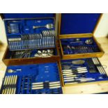 Two Mappin part cutlery sets on tray levels, both in wood carry cases.