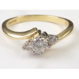 Diamond three stone crossover ring in 9ct.