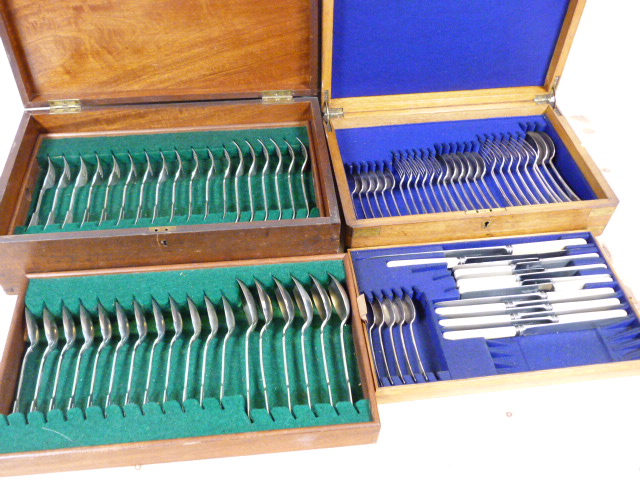 Two e.p. cutlery sets, one full set together with one partial set. Both in wooden cases.