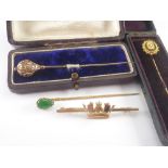 Jadeite pin, two others and another, naval crown '9ct'.