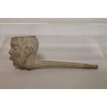 Giant clay pipe in the form of an African man's head by Thomas Holland, 1873, 19cm long.