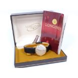 Gents Longines 9ct gold watch, manual in 9ct gold, inscribed, 1973, with tag leaflet and box.