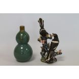 Modern Oriental green glazed vase of double gourd form with brown drip glazes to rim,