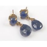 Pair of drop earrings, each with a pearl shaped sapphire dependant from another.