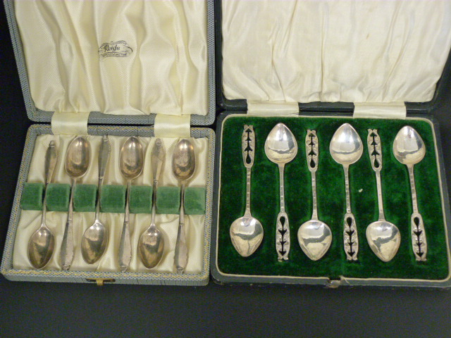 Set of six silver coffee spoons of Arts and Crafts style, hammered and pierced by A E Jones,