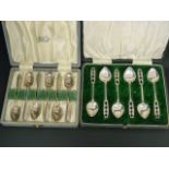 Set of six silver coffee spoons of Arts and Crafts style, hammered and pierced by A E Jones,