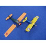 Two small scale model planes, both with petrol engines.