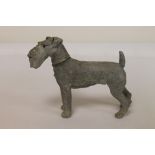 Moulded metal table lighter in the form of an Airedale Terrier, with traces of cold painting.