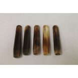 Five various horn cheroot holders, the largest 7cm long. (5).