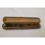 W.H. Newman Ltd tortoiseshell cigarette holder with 9ct gold mount, c1900, 11.5cm long cased.