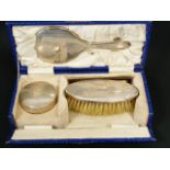 Child's silver hair brush, mirror, comb and trinket box, cased.