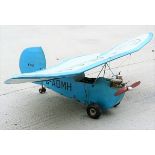 A small scale model plane, G-ADMH, blue,