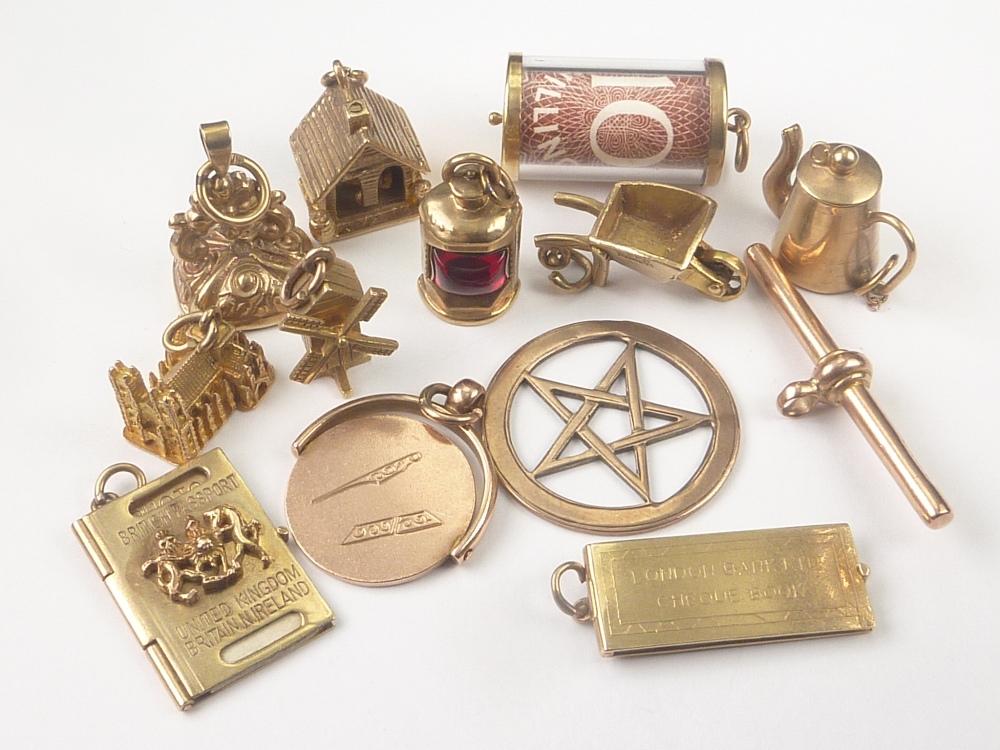 Ten 9ct gold charms and three similar items. Condition Report.