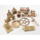 Ten 9ct gold charms and three similar items. Condition Report.