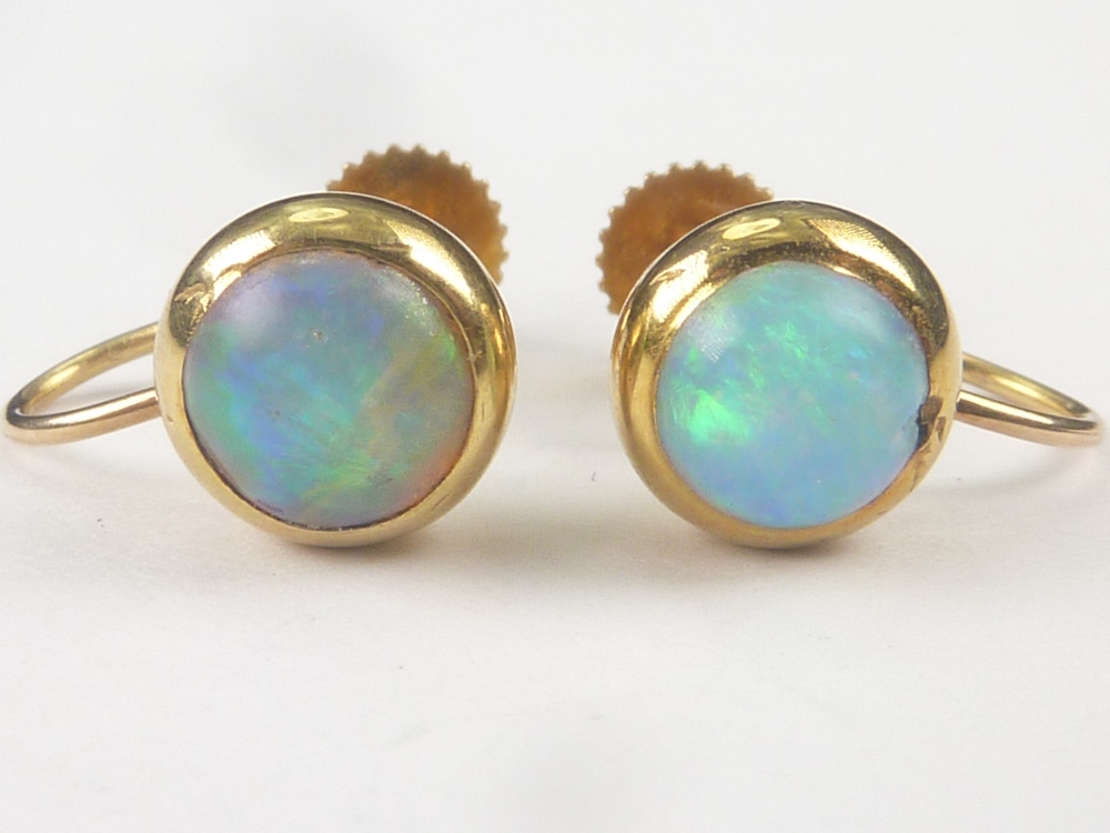 Pair of opal earrings of button shape, screw fittings in gold. - Image 2 of 2