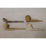 Four clay pipes; The Victory Pipe, 14cm long and The Churchill Pipe,