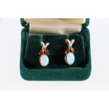 18ct yellow gold opal stud earrings with red and ivory enamel.