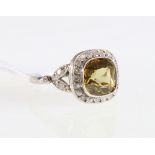 18ct white gold chrysoberyl and white sapphire cluster ring.