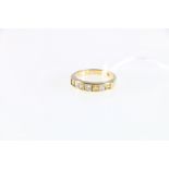 18ct yellow gold yellow sapphire and diamond set half-hoop eternity ring.