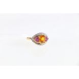 18ct yellow gold golden sapphire, pink sapphire and diamond set marquise cluster ring.