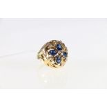 18ct yellow and white gold blue sapphire and diamond set cluster ring.