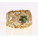 18ct yellow gold green spinel and diamond set scrolled wire dress ring.